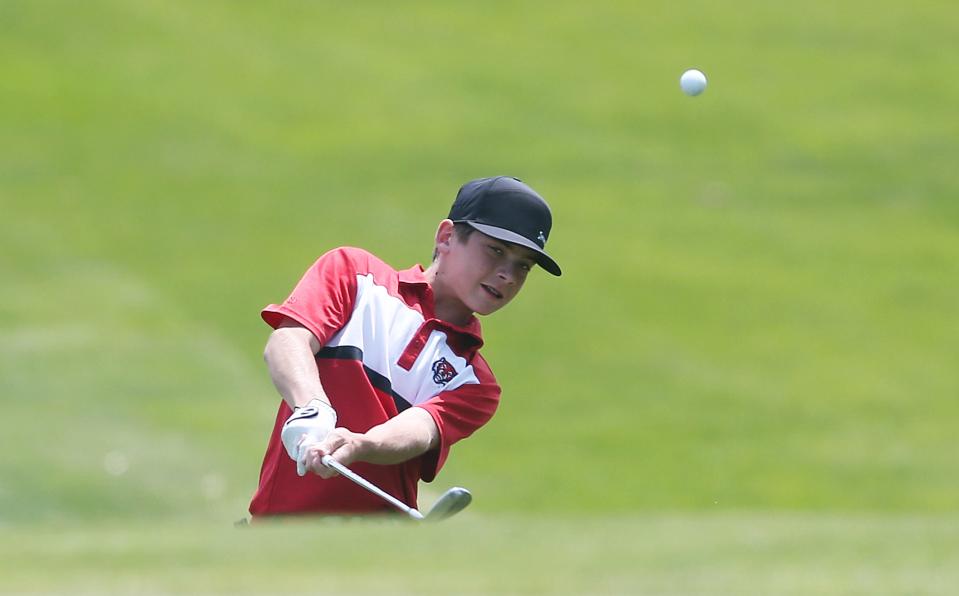 ADM's Carter Madison chips the ball onto the 18th hole in the class 3A boys' state golf championship at Veenker Golf Course Tuesday, May 23, 2023, in Ames, Iowa.
