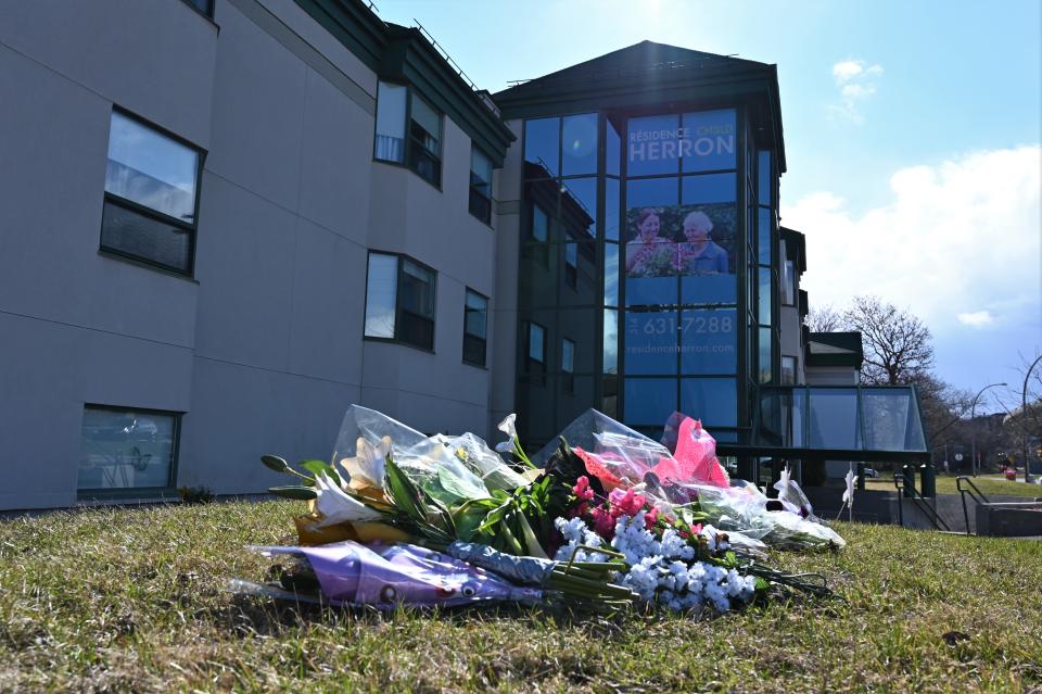 Flowers were left outside Résidence Herron in the spring as it became a focal point in the province's concerning situation within CHSLDs. (Credit: Eric Thomas/AFP via Getty Images)