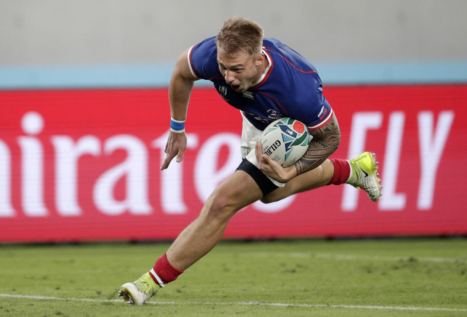 Russia's Kirill Golosnitskiy reacts as he scores his team's first try during the Rugby World Cup Pool A game at Tokyo Stadium between Russia and Japan in Tokyo, Japan, Friday, Sept. 20, 2019. (AP Photo/Jae Hong)