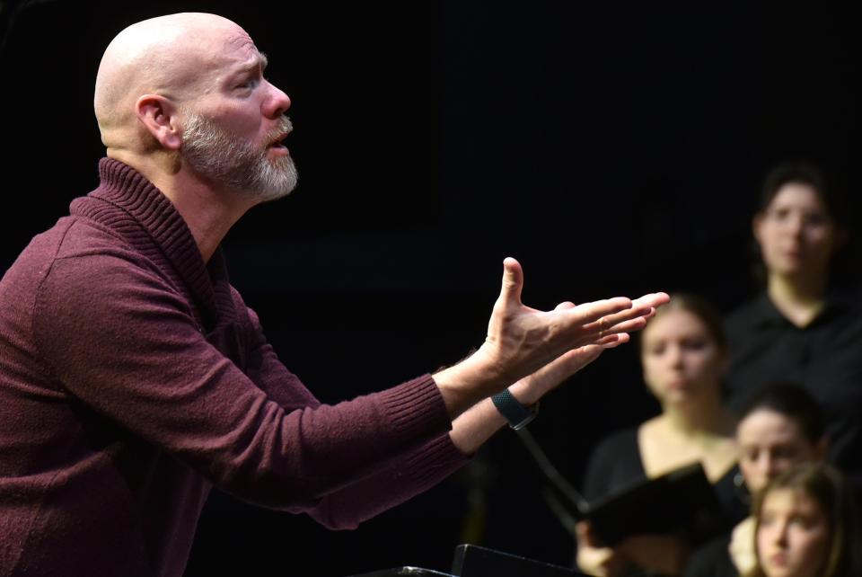 Director Clay Jolly draws out the voices of the mixed chorus as over 250 students had a final morning practice on Feb. 4 at Barnstable High School before an afternoon performance at the All Cape and Islands Music Festival, featuring a band, orchestra, treble chorus and mixed chorus.