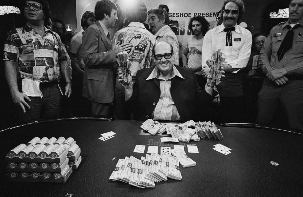 Doyle Brunson, seen here with his $340,000 cash prize after winning the 1977 World Series of Poker main event. (Tony Korody/Sygma/Sygma via Getty Images)