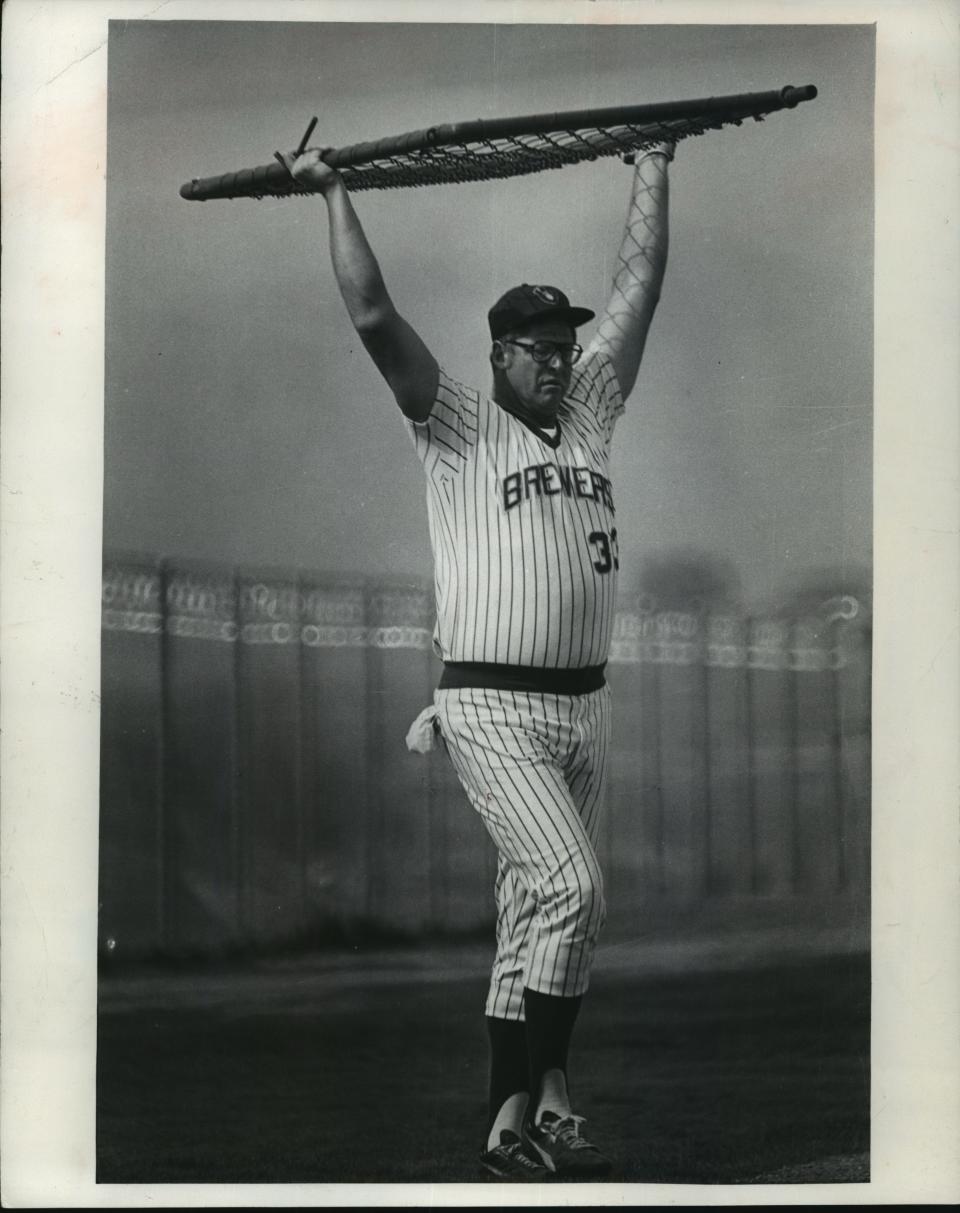 Frank Howard, imposing at 6-7, moves equipment around during spring training in 1979.