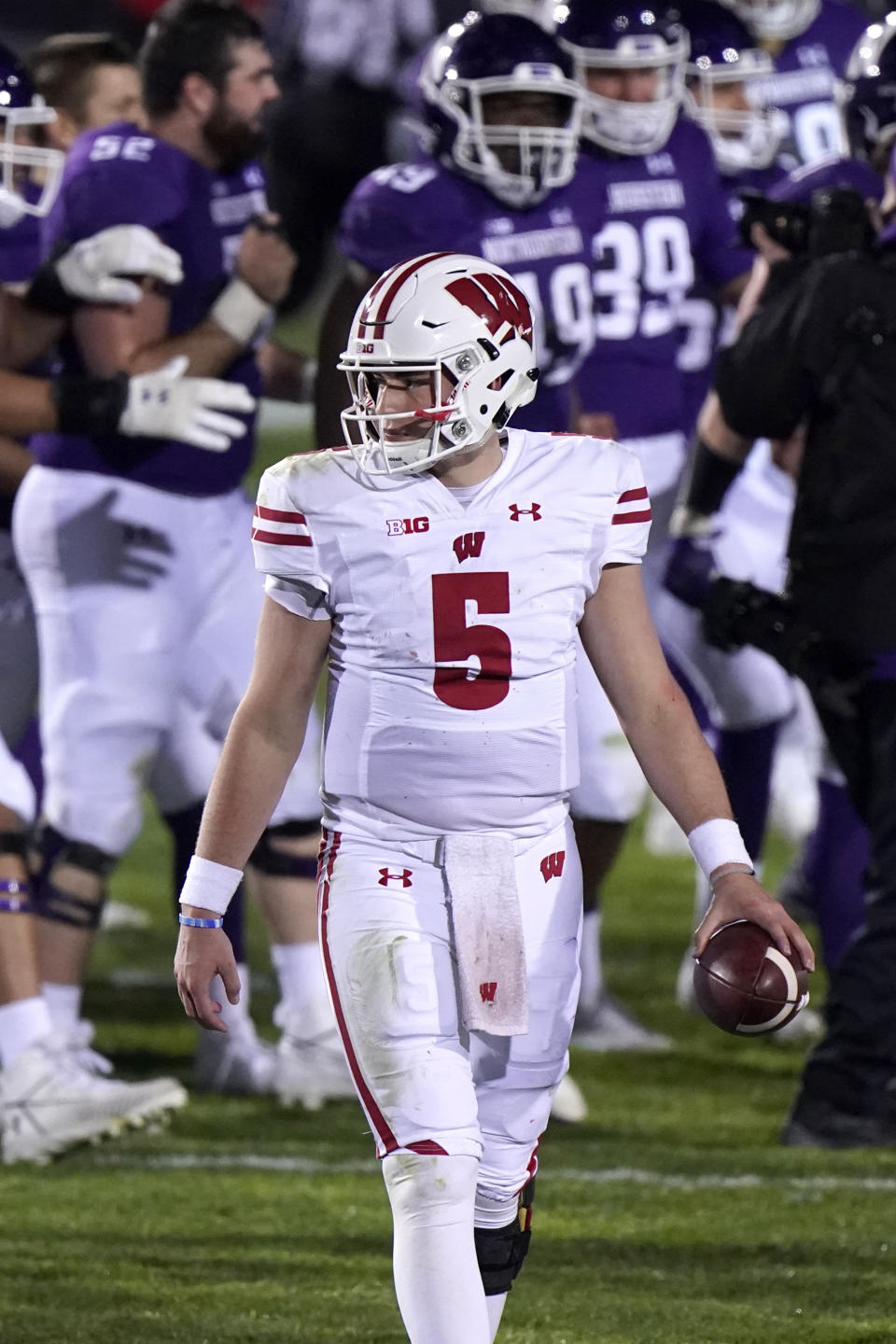 Wisconsin quarterback Graham Mertz (5) walks off the field after a 17-7 loss to Northwestern in an NCAA college football game in Evanston, Ill., Saturday, Nov. 21, 2020. (AP Photo/Nam Y. Huh)