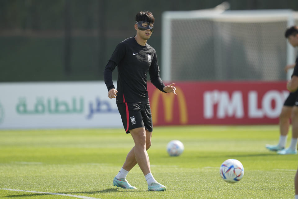 South Korea's Son Heung-min warms up during the South Korea's official training on the eve of the group H World Cup soccer match between South Korea and Ghana, at the Al Egla Training Site 5 in Doha, Qatar, Sunday, Nov. 27, 2022. (AP Photo/Lee Jin-man)