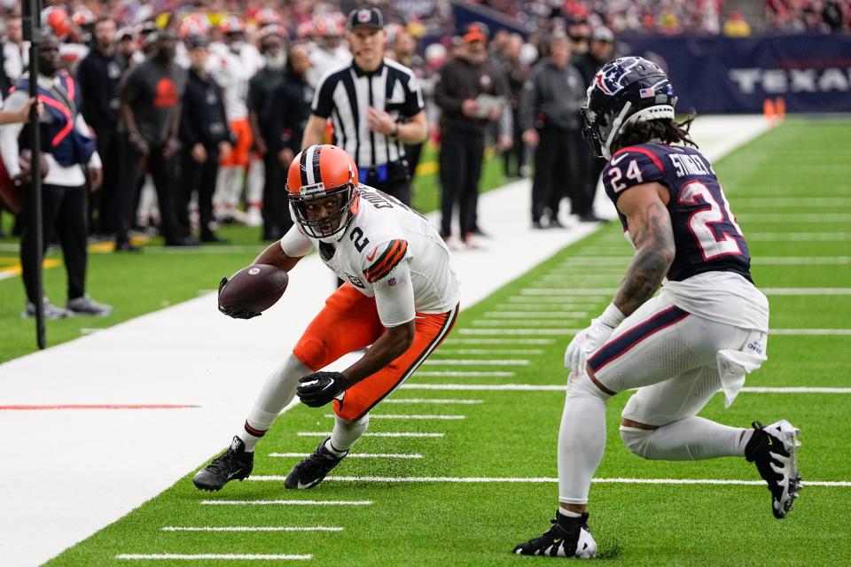 Cleveland Browns wide receiver Amari Cooper (2) catches a pass as Houston Texans cornerback Derek Stingley Jr. (24) defends during the second half of an NFL football game Sunday, Dec. 24, 2023, in Houston.