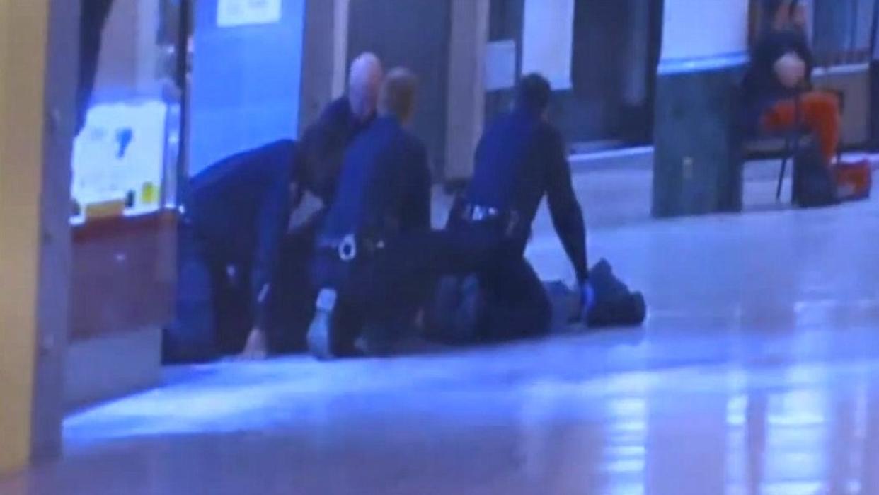 <div>McKenzie Cochran being detained by security guards at the now-shuttered Northland Mall.</div>