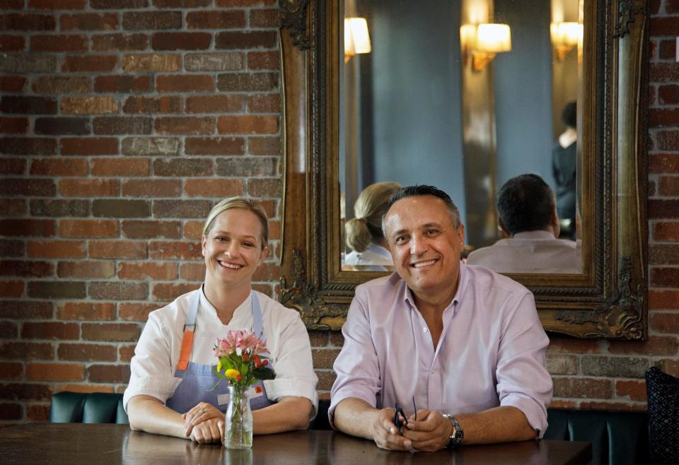 Lindsay Autry and Thierry Beaud, partners at The Regional restaurant, pose for a photo shortly before reopening the restaurant in December 2021 after a 17-month pandemic-related closure.