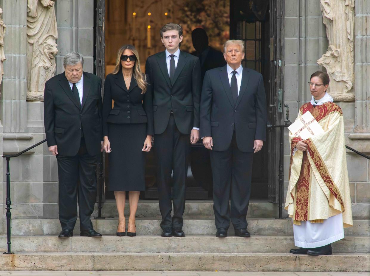 Viktor Knavs (from left), Melania Trump, Barron Trump, former President Donald Trump and Bethesda-by-the-Sea Rector the Rev. Tim Schenck await the arrival of the casket of Amalija Knavs at the church on Thursday.