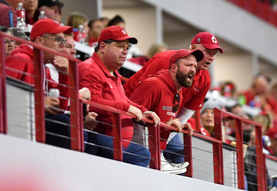 Angry South Dakota football fans yell encouragement at the team as they fail to make much forward momentum in the first half of the FCS playoff game against Southern Illinois on Saturday, November 27, 2021, at the DakotaDome in Vermillion.