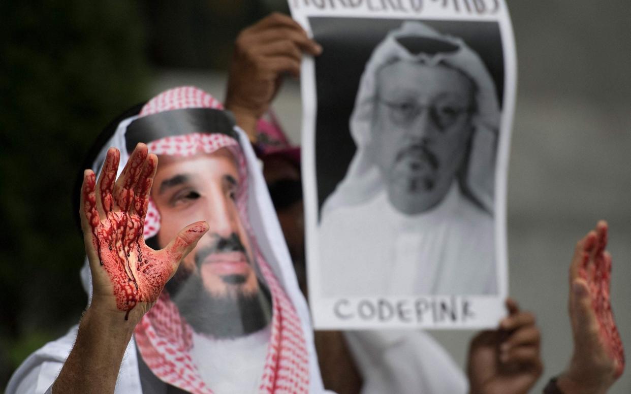 A demonstrator dressed as MBS with blood on his hands protests outside the Saudi Embassy in Washington, DC, demanding justice for Saudi journalist Jamal Khashoggi. - AFP