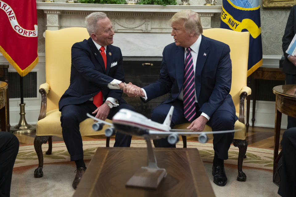 President Donald Trump meets with Rep. Jeff Van Drew, D-N.J., who is planning to switch his party affiliation, in the Oval Office of the White House, Thursday, Dec. 19, 2019, in Washington. (AP Photo/ Evan Vucci)