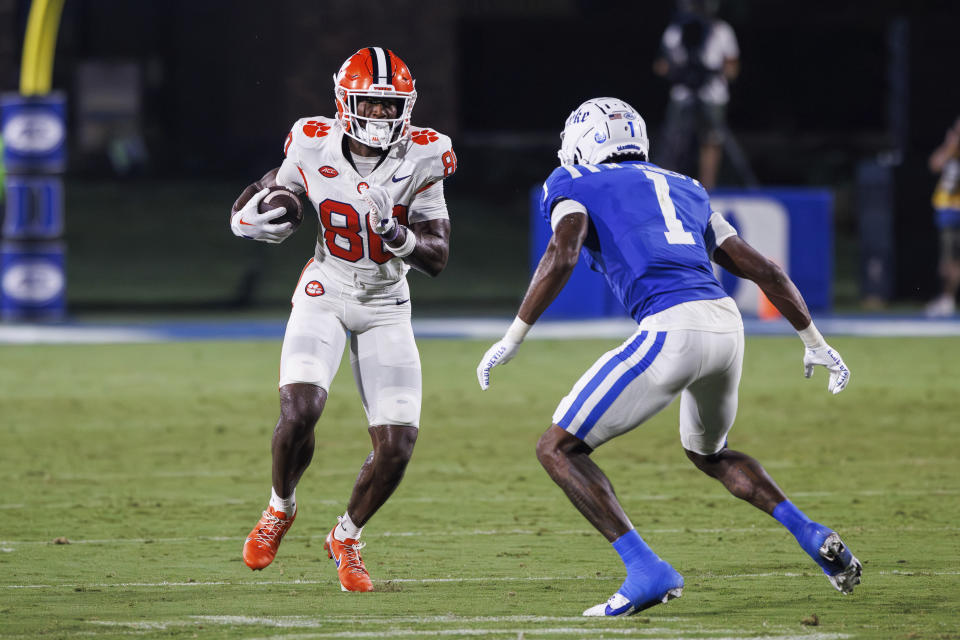 Clemson's Beaux Collins (80) carries the ball in front of Duke's Myles Jones (1) during the second half of an NCAA college football game in Durham, N.C., Monday, Sept. 4, 2023. (AP Photo/Ben McKeown)
