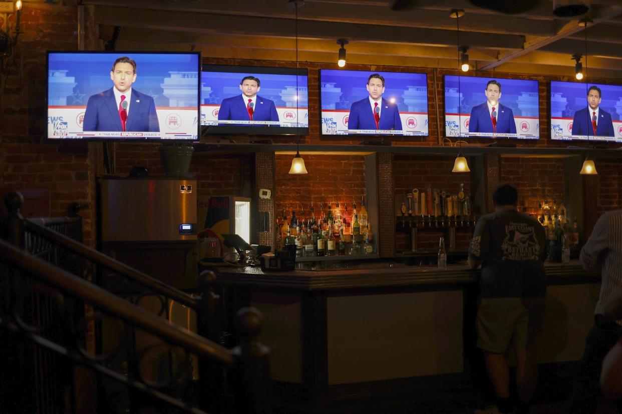 GOP presidential candidate Ron DeSantis on television screens at a Washington, D.C. bar during the first 2024 Republican presidential primary debate on Aug. 23, 2023. <a href="https://www.gettyimages.com/detail/news-photo/republican-presidential-candidate-and-florida-gov-ron-news-photo/1635010270?adppopup=true" rel="nofollow noopener" target="_blank" data-ylk="slk:Anna Moneymaker/Getty Images;elm:context_link;itc:0;sec:content-canvas" class="link ">Anna Moneymaker/Getty Images</a>