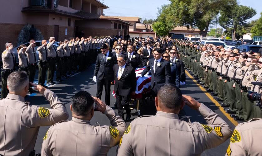 Sylmar, CA - May 09: Los Angeles County Sheriff's Deputy Freddy Flores's casket is carried into St. Didicus Catholic Church for his funeral mass on Thursday, May 9, 2024 in Sylmar, CA. (Brian van der Brug / Los Angeles Times)