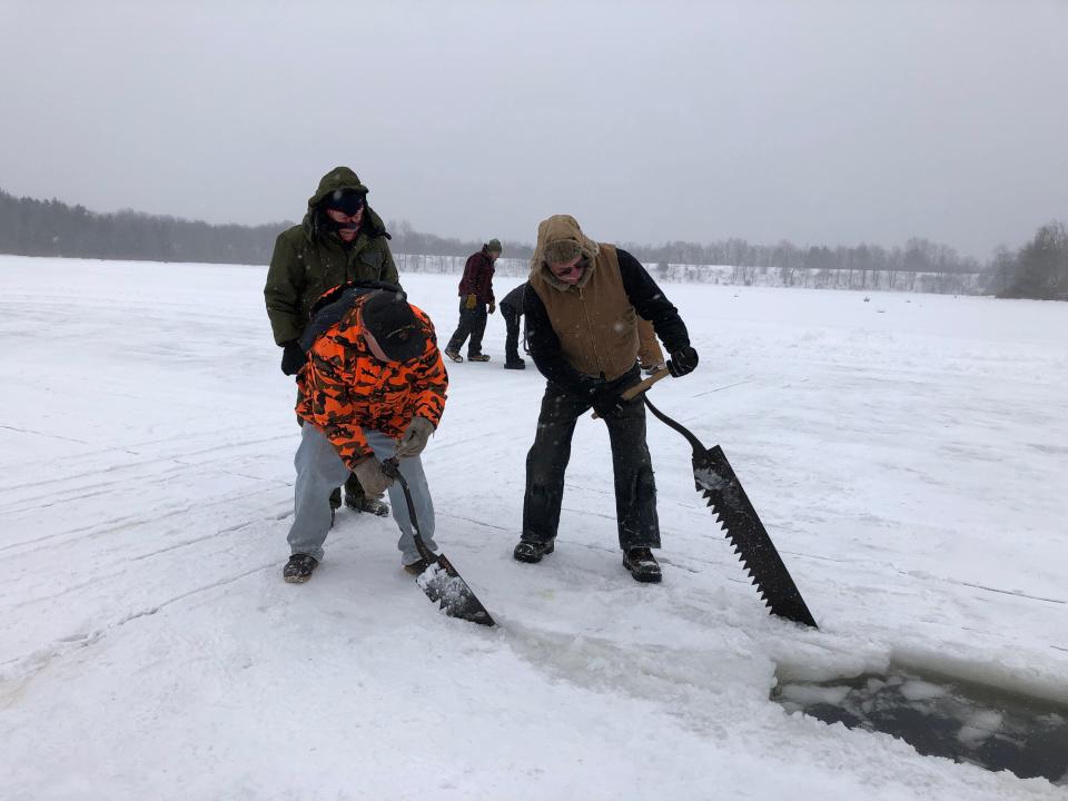 Volunteers cut through the ice at the annual Tobyhanna Ice Harvest on Saturday, Jan. 29, 2022.