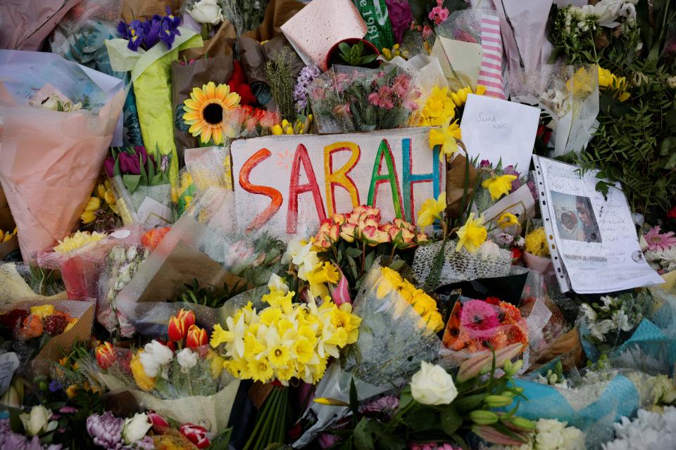 Floral tributes and messages in honour of Sarah Everard, the missing woman who's remains were found in woodland in Kent, are displayed at the bandstand on Clapham Common in south London on March 17, 2021. - Prime Minister Boris Johnson said Wednesday Britain needed 