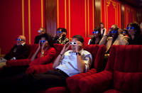 <p>During a Super Bowl watching party in the White House theatre on Feb. 1 2009, the President and First Lady join their guests in watching one of the TV commercials in 3D. (Pete Souza/The White House) </p>