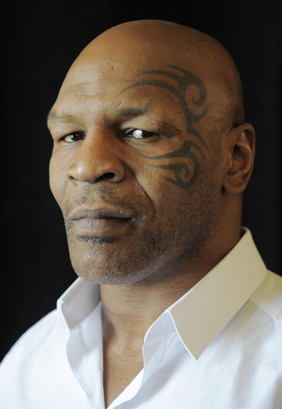 MIke Tyson, whose one-man stage show is chronicled in Spike Lee's film "Mike Tyson: Undisputed Truth," poses backstage during HBO's Summer 2013 TCA panel at the Beverly Hilton Hotel on Thursday, July 25, 2013, in Beverly Hills, Calif. The program was filmed on Broadway, where ``Mike Tyson: Undisputed Truth’’ ran last summer. (Photo by Chris Pizzello/Invision/AP)