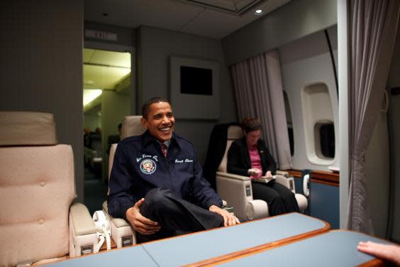 Barack Obama wearing his personalised jacket on board Air Force One. (Flickr/Obama White House)