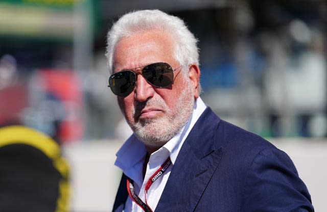 Aston Martin chairman Lawrence Stroll wearing sunglasses