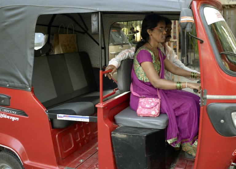 Female drivers receive different colour rickshaws to the traditional black and yellow ones, to discourage male relatives from taking them