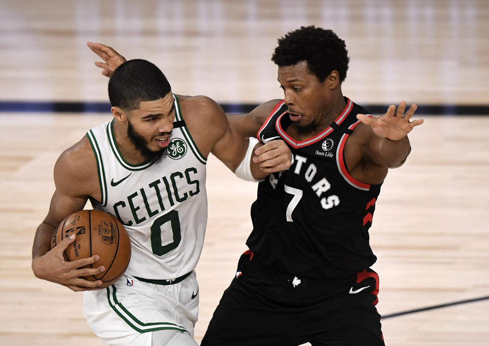 LAKE BUENA VISTA, FLORIDA - SEPTEMBER 05: Jayson Tatum #0 of the Boston Celtics drives the ball during the fourth quarter against Kyle Lowry #7 of the Toronto Raptors in Game Four of the Eastern Conference Second Round during the 2020 NBA Playoffs at the Field House at the ESPN Wide World Of Sports Complex on September 05, 2020 in Lake Buena Vista, Florida. NOTE TO USER: User expressly acknowledges and agrees that, by downloading and or using this photograph, User is consenting to the terms and conditions of the Getty Images License Agreement. (Photo by Douglas P. DeFelice/Getty Images)