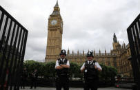 FILE PHOTO: Police officers stand guard in front of Big Ben at the entrance to the Palace of Westminster in London, Britain, June 8, 2017. REUTERS/Marko Djurica/File Photo