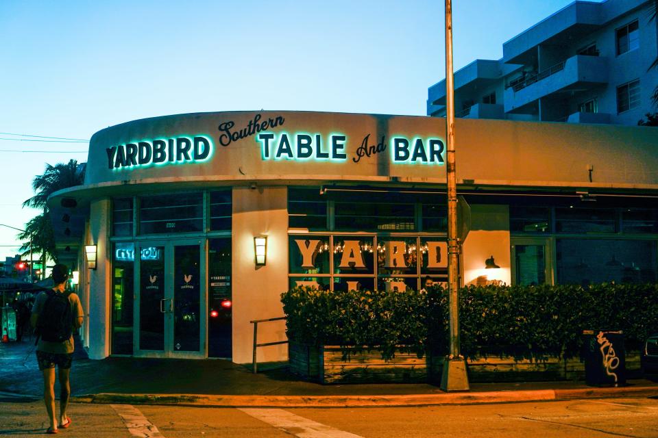 The outside of Yardbird Table Bar at night