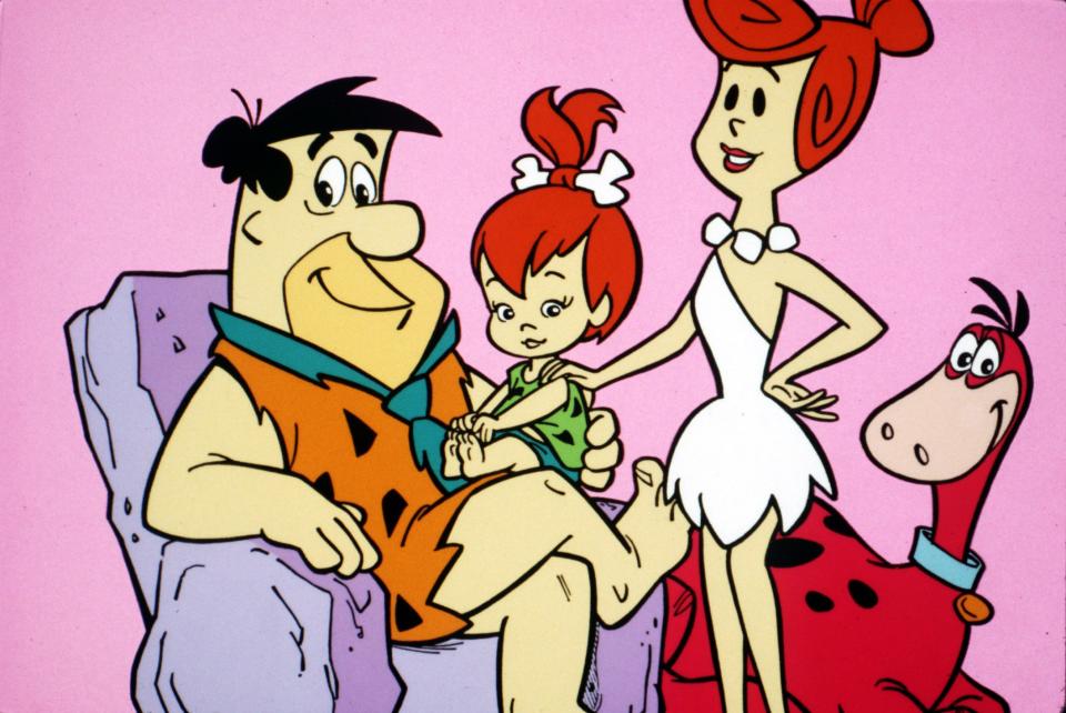 Fred, Pebbles, Wilma and Dino in "The Flintstones."