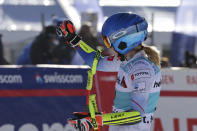 United States' Mikaela Shiffrin celebrates in the finish area of an alpine ski, women's World Cup super-G in St. Moritz, Switzerland, Sunday, Dec. 12, 2021. (AP Photo/Marco Trovati)