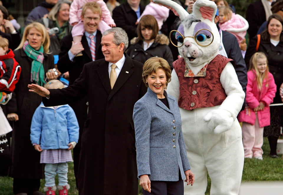 President Bush and first lady Laura Bush stand with the Easter Bunny while welcoming guests in 2008.