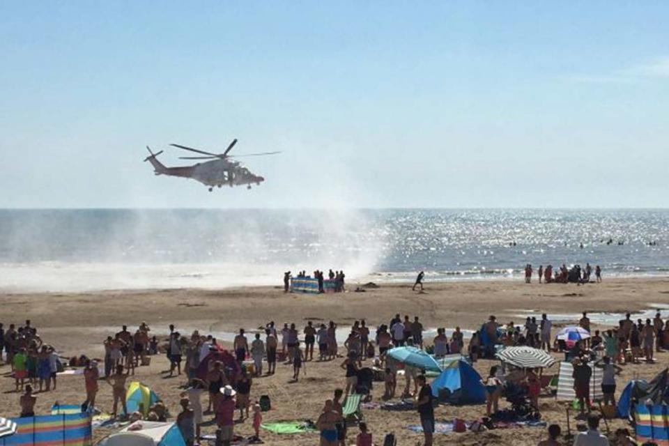 A rescue helicopter during the operation at Camber Sands (@Tashka4 /PA Wire)