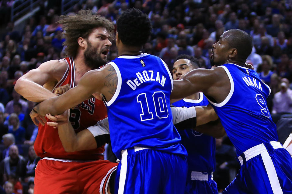 <p>Robin Lopez #8 of the Chicago Bulls fights with DeMar DeRozan #10 and Serge Ibaka #9 of the Toronto Raptors during the second half of an NBA game at Air Canada Centre on March 21, 2017 in Toronto, Canada. NOTE TO USER: User expressly acknowledges and agrees that, by downloading and or using this photograph, User is consenting to the terms and conditions of the Getty Images License Agreement. (Photo by Vaughn Ridley/Getty Images) </p>