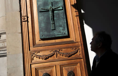 A man leaves from the Santiago cathedral after a mass, in Santiago, Chile July 24, 2018. Picture taken July 24, 2018. REUTERS/Ivan Alvarado