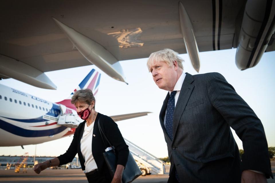 Boris Johnson with Dame Barbara Janet Woodward, Permanent Representative of the UK to the UN, at New York’s JFK Airport  (PA Wire)