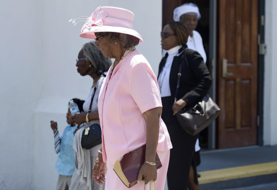 People depart the Emanuel AME Church following Sunday services June 21, 2015 in Charleston, South Carolina.  Large crowds are expected at Sunday's service at the black church in Charleston where nine African Americans were gunned down, as a chilling website apparently created by the suspected white supremacist shooter emerged. The service will be the first since the bloodbath on Wednesday at the Emanuel African Methodist Episcopal Church in the southern state of South Carolina, which has fuelled simmering racial tensions in the United States and reignited impassioned calls for stronger gun-control laws. AFP PHOTO/BRENDAN SMIALOWSKI        (Photo credit should read BRENDAN SMIALOWSKI/AFP/Getty Images)