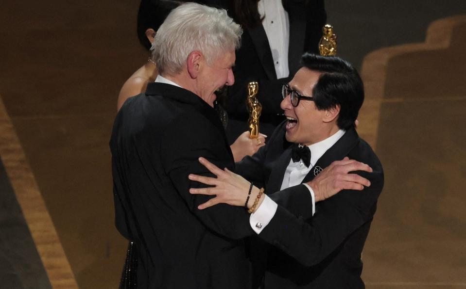 Former co-stars Harrison Ford and Ke Huy Quan reunited at the Oscars - CARLOS BARRIA