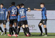 Atalanta's Berat Djimsiti, right, celebrates after scoring his side's opening goal during the Serie A soccer match between Atalanta and Sassuolo at the Gewiss Stadium in Bergamo, Italy, Sunday, June 21, 2020. Atalanta is playing its first match in Bergamo since easing of lockdown measures, in the area that has been the epicenter of the hardest-hit province of Italy's hardest-hit region, Lombardy, the site of hundreds of COVID-19 deaths. (AP Photo/Luca Bruno)