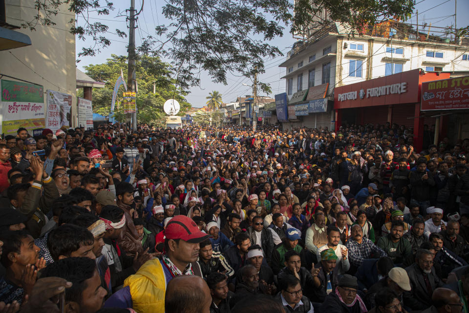 Indians shout slogans during a protest against the Citizenship Amendment Act in Nalbari, India, Friday, Dec. 20, 2019. Police banned public gatherings in parts of the Indian capital and other cities for a third day Friday and cut internet services to try to stop growing protests against a new citizenship law that have left more than 10 people dead and more than 4,000 others detained. (AP Photo/Anupam Nath)