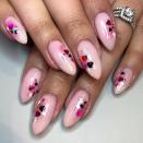 <p>Grab a bunch of small, heart-shaped glitter and place them across a pale pink nail for a classic Valentine’s Day nail look. </p><p><a href="https://www.instagram.com/p/B8VOgwhlmxY/" rel="nofollow noopener" target="_blank" data-ylk="slk:See the original post on Instagram;elm:context_link;itc:0;sec:content-canvas" class="link ">See the original post on Instagram</a></p>