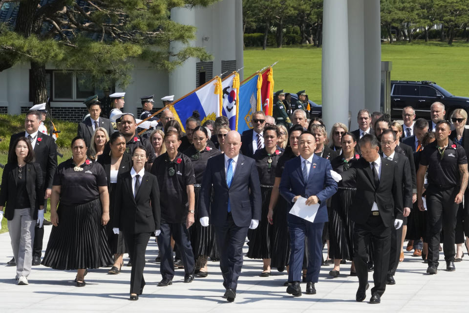 New Zealand's Prime Minister Christopher Luxon, front center, arrives at National Cemetery in Seoul, South Korea, Wednesday, Sept. 4, 2024. (AP Photo/Ahn Young-joon)