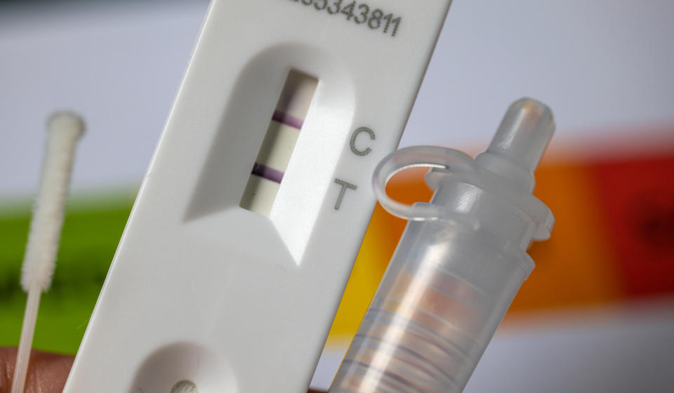 Close-up of rapid Covid-19 home lateral flow antigen test with positive result