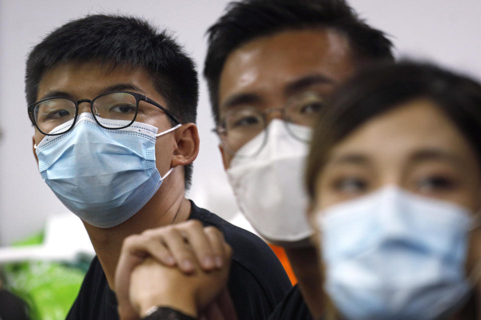 Pro-democracy activists who were elected from unofficial pro-democracy primaries, including Joshua Wong, left, attend a press conference in Hong Kong, Wednesday, July 15, 2020. Young activists and localist candidates dominated Hong Kong's unofficial pro-democracy primaries over the weekend, with hundreds of thousands of people voting despite warnings the election could violate the territory's new security law imposed by Beijing. (AP Photo/Kin Cheung)