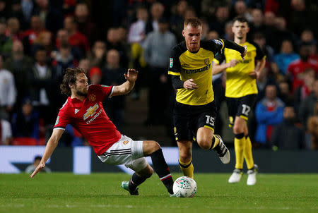 Soccer Football - Carabao Cup Third Round - Manchester United vs Burton Albion - Old Trafford, Manchester, Britain - September 20, 2017 Manchester United's Daley Blind in action with Burton Albion's Tom Naylor REUTERS/Andrew Yates