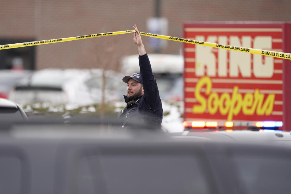 Police work on the scene outside a King Soopers grocery store where a shooting took place Monday, March 22, 2021, in Boulder, Colo. (AP Photo/David Zalubowski)