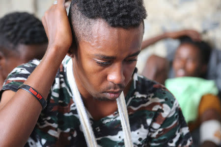 A Somali refugee, who was among survivors of an attack on a boat off Yemen's coast in the Red Sea, sits at a detention center in the Houthi-held port of Hodeidah, Yemen, March 22, 2017. Picture taken March 22. REUTERS/Abduljabbar Zeyad