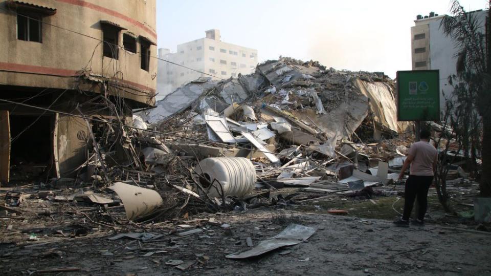 Palestinian citizens inspect damage to their homes after Israel retaliated with airstrikes on Sunday in Gaza City, Gaza.