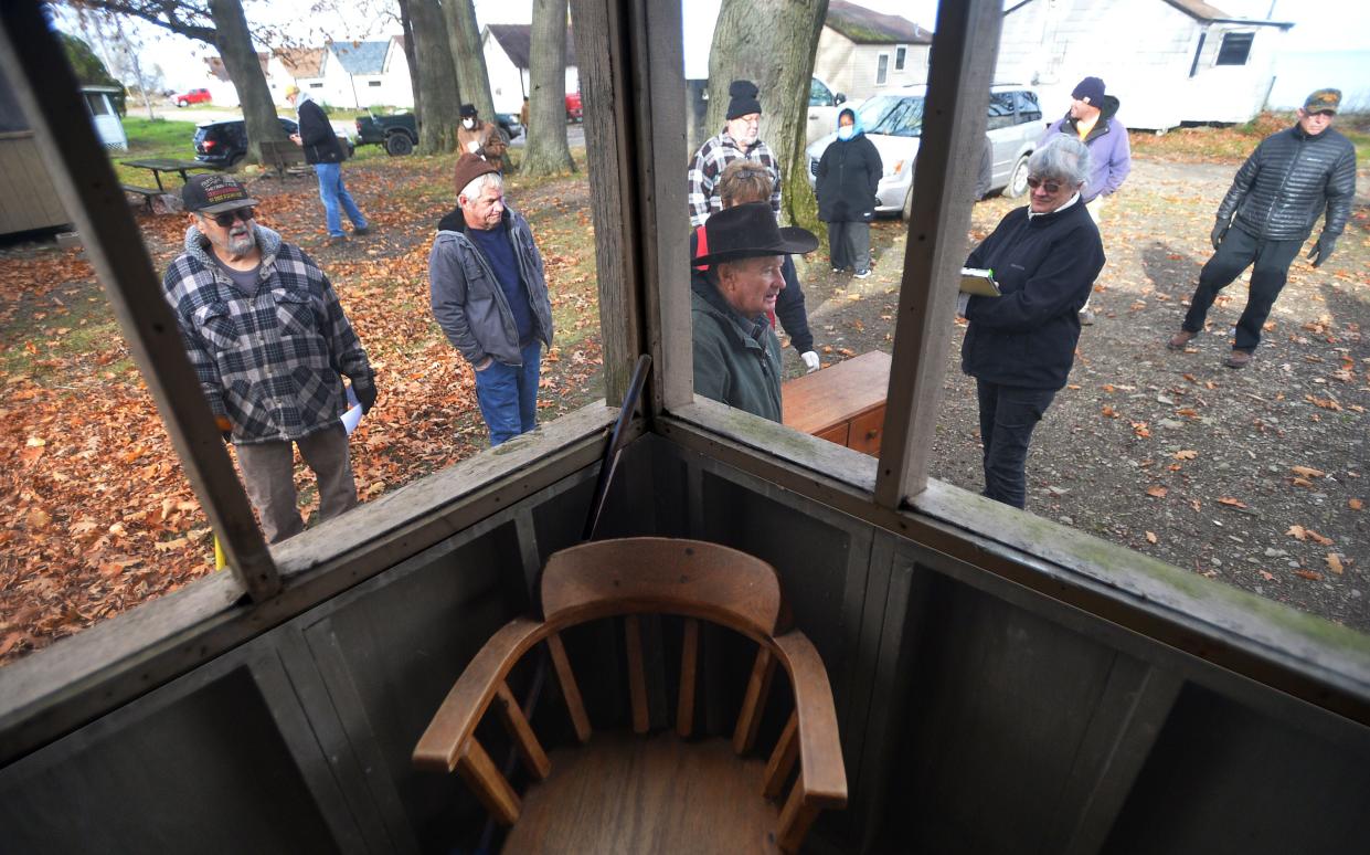 Visitors crowd the Dohler Cottages property in North East Township during an auction of the cottages and their contents on Nov. 20, 2021, as part of the Dohler Cottages bankruptcy case.