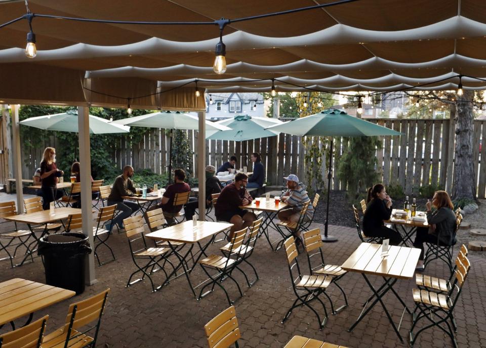 Patrons enjoy the patio under a canopy at Gemut Biergarden in Columbus, Ohio, on Sept. 21.