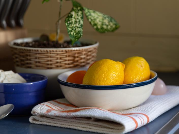 bowl of lemons fruit kitchen decor plant